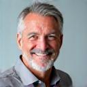 Confident man in his 50s, Mark, looking fit and energetic, representing weight loss and fitness achievement.