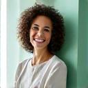 Portrait of a smiling 44-year-old executive, looking well-rested and confident.