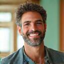 Portrait of a serene 51-year-old teacher, appearing calm and happy.